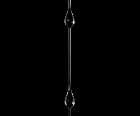 Graphical abstract: Scaling analysis for the frequency of Ostwaldian and Newtonian bead-on-fibre flows